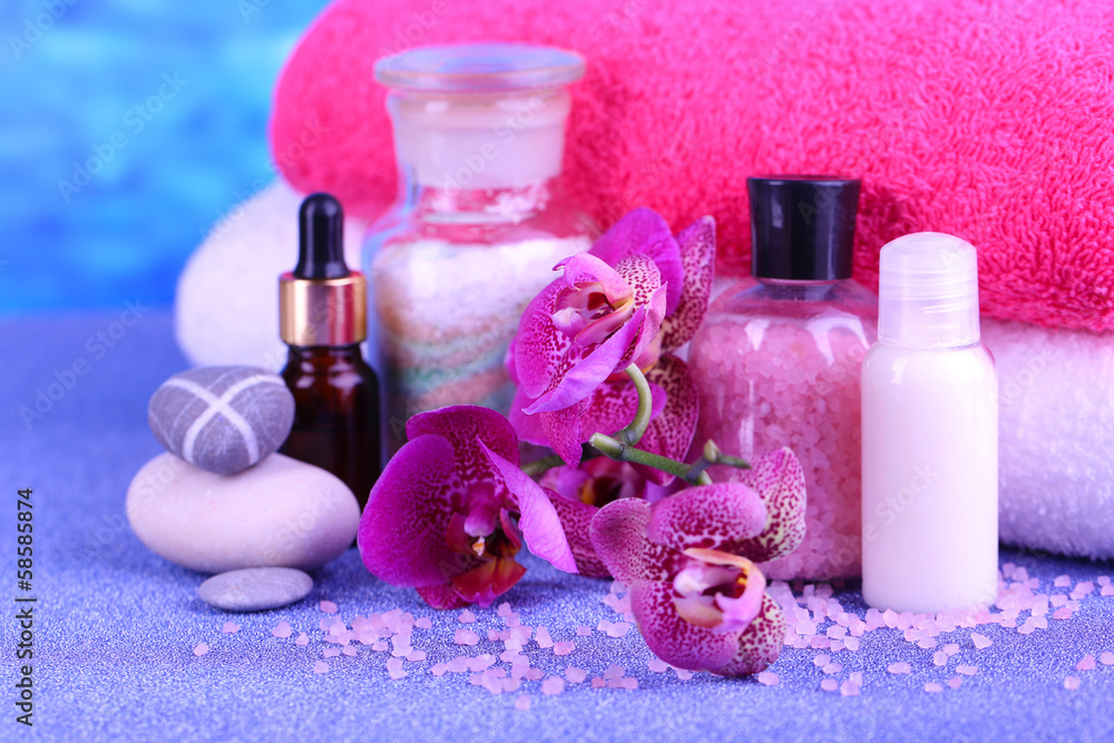 Beautiful spa setting with orchid on blue background Beautiful spa setting with orchid on blue background