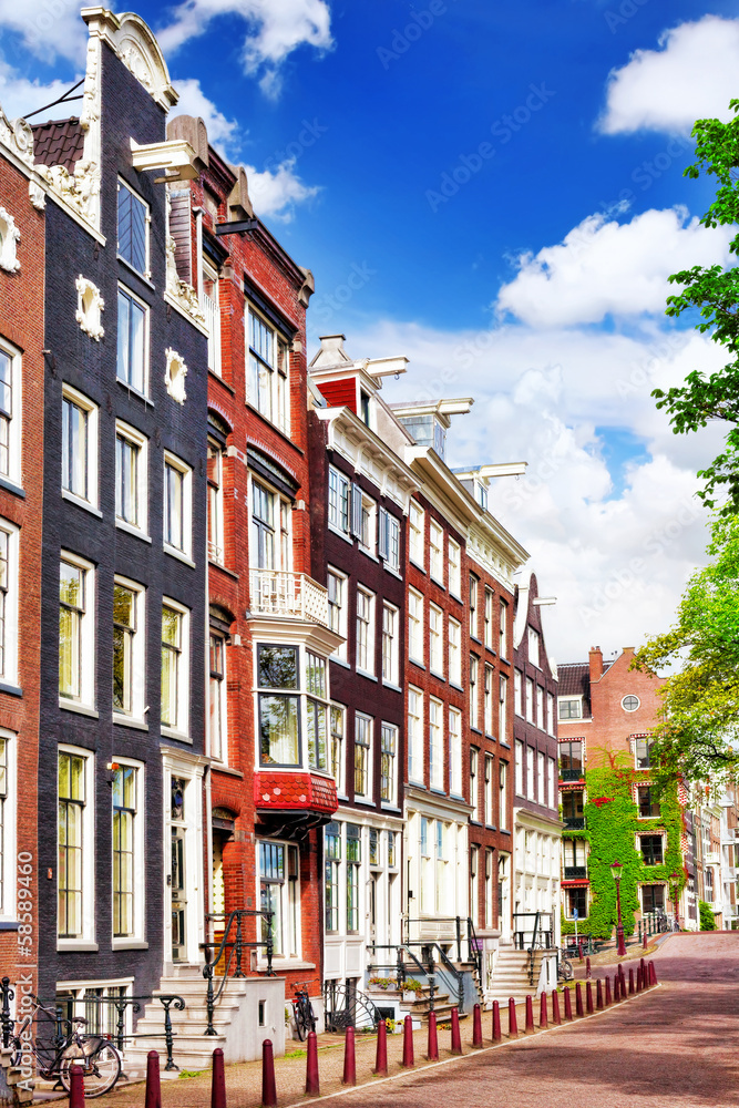 Obraz premium Amsterdam and typical houses with clear summer sky.Netherlands