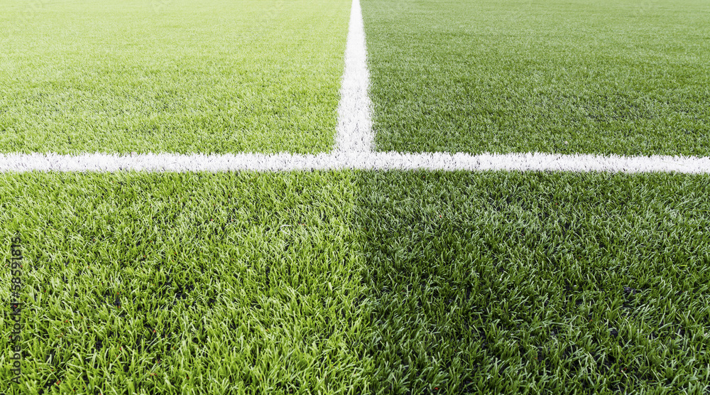 Green grass with white line of football field