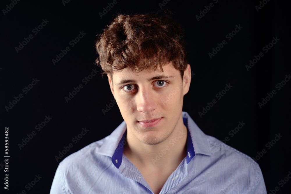 young Man slightly smiling young Man slightly smiling