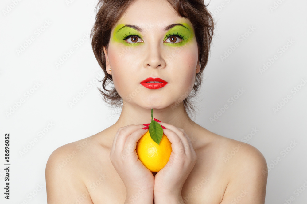 Asian girl with lemon in her hand Asian girl with lemon in her hand