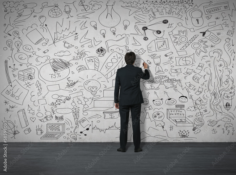 Businessman drawing on the wall Businessman drawing on the wall