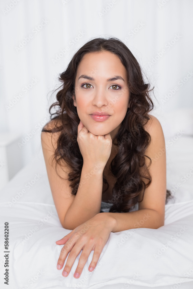 Portrait of a pretty brunette lying in bed Portrait of a pretty brunette lying in bed