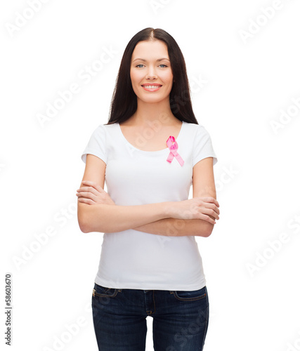 smiling woman with pink cancer awareness ribbon © Syda Productions