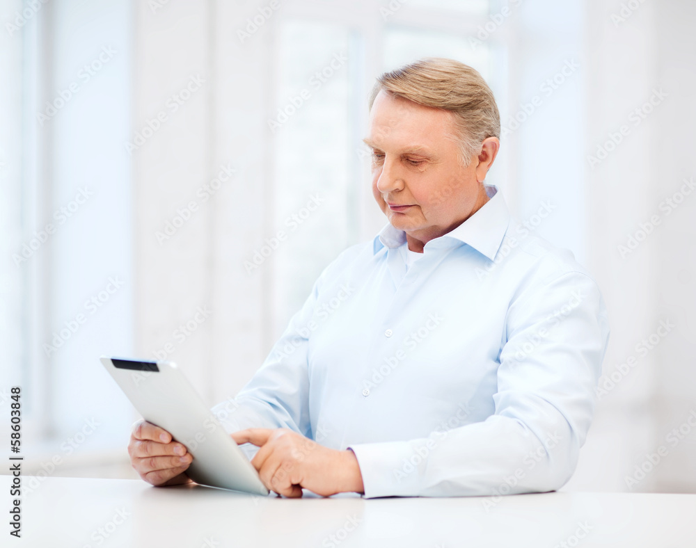 old man with tablet computer at home old man with tablet computer at home