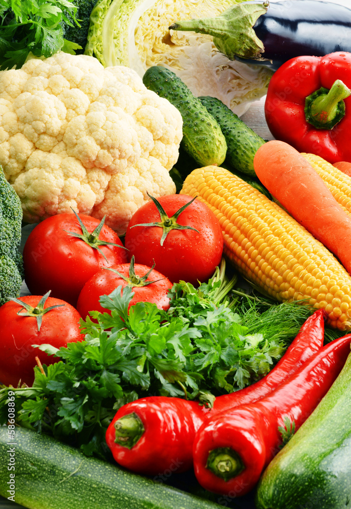 Composition with variety of fresh raw organic vegetables Composition with variety of fresh raw organic vegetables