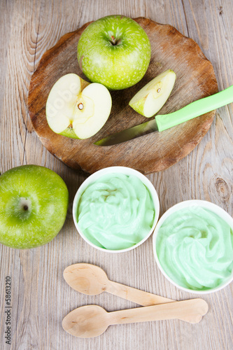 Frozen creamy ice yoghurt  with fresh green apples photo