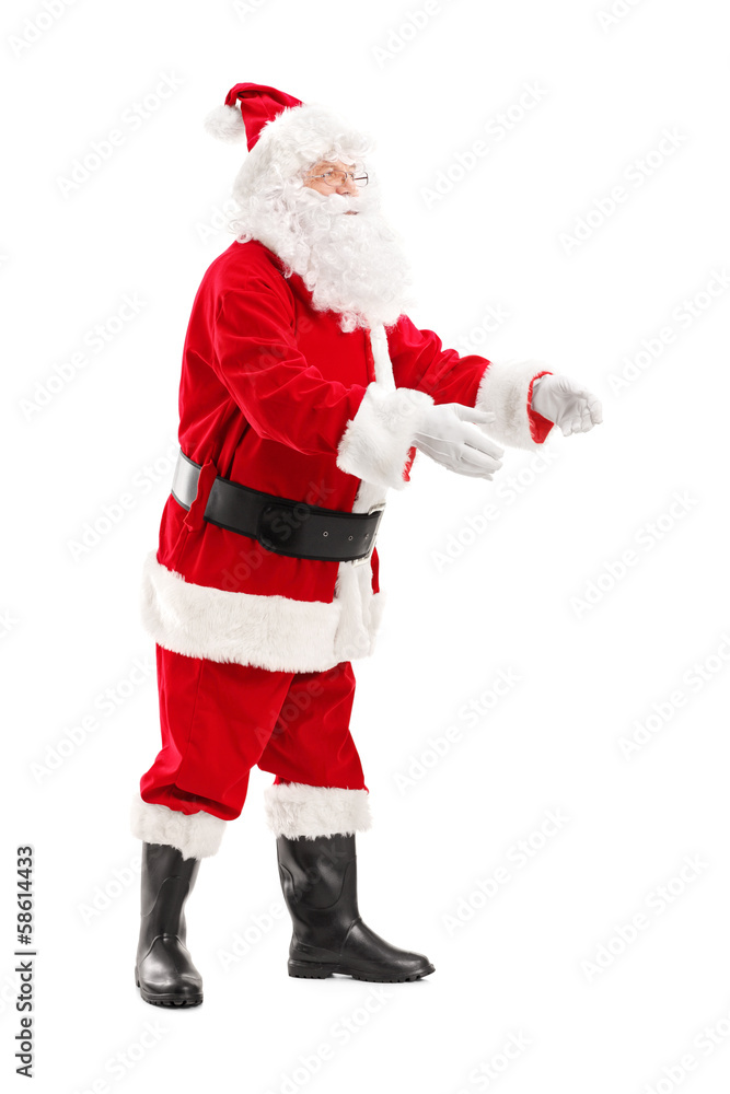 Full length portrait of a Santa Claus about to take something Full length portrait of a Santa Claus about to take something