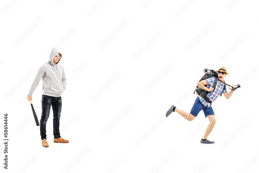 Guy holding a baseball bat and scared tourist trying to run away Guy holding a baseball bat and scared tourist trying to run away