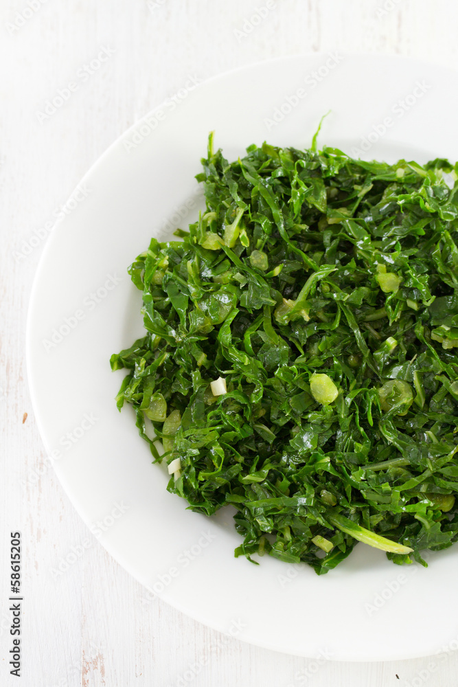 boiled cabbage on white plate