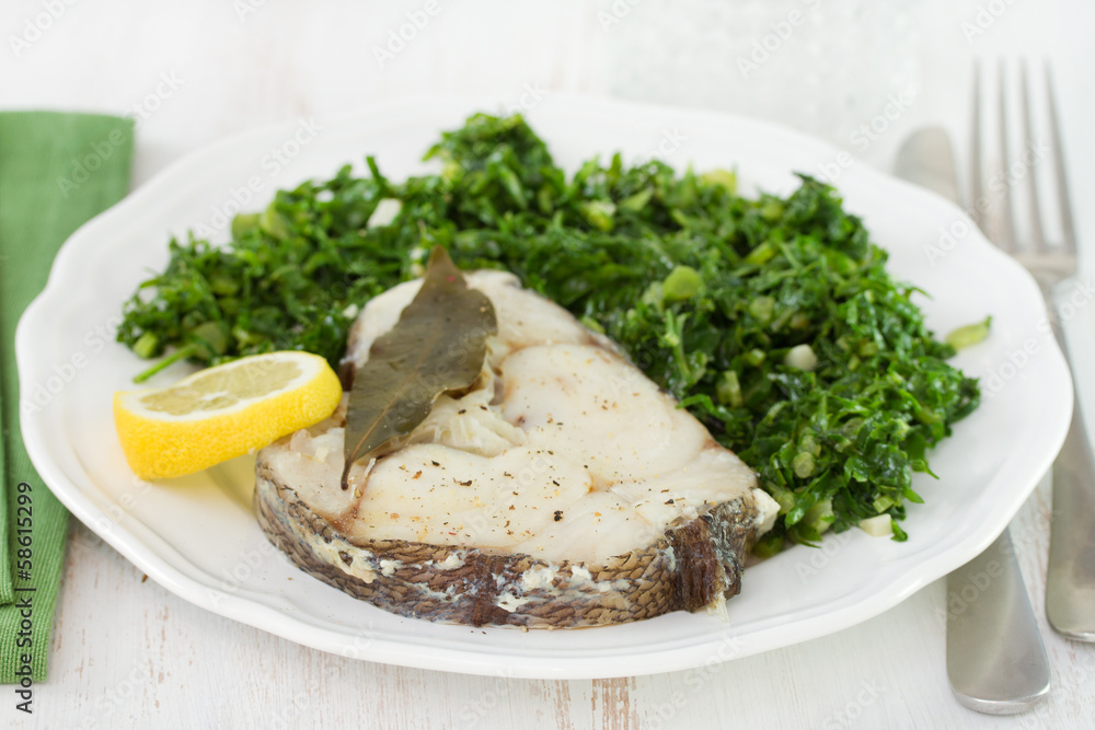 boiled fish with lemon and cabbage on plate boiled fish with lemon and cabbage on plate