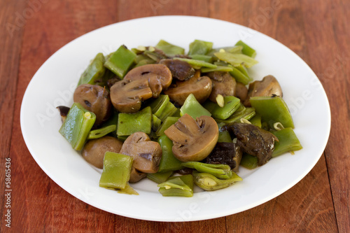 green beans with mushrooms on plate