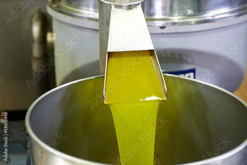 fresh oil flowing in the bin
