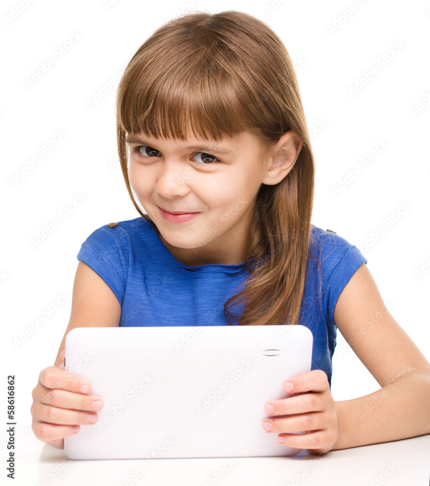 Young cheerful girl is using tablet Young cheerful girl is using tablet