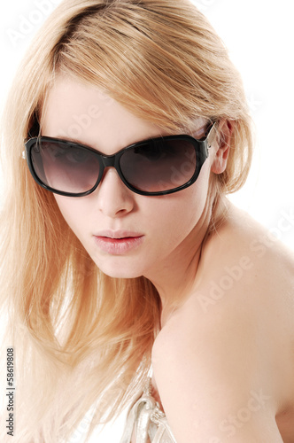Portrait of a young blonde girl in sunglasses