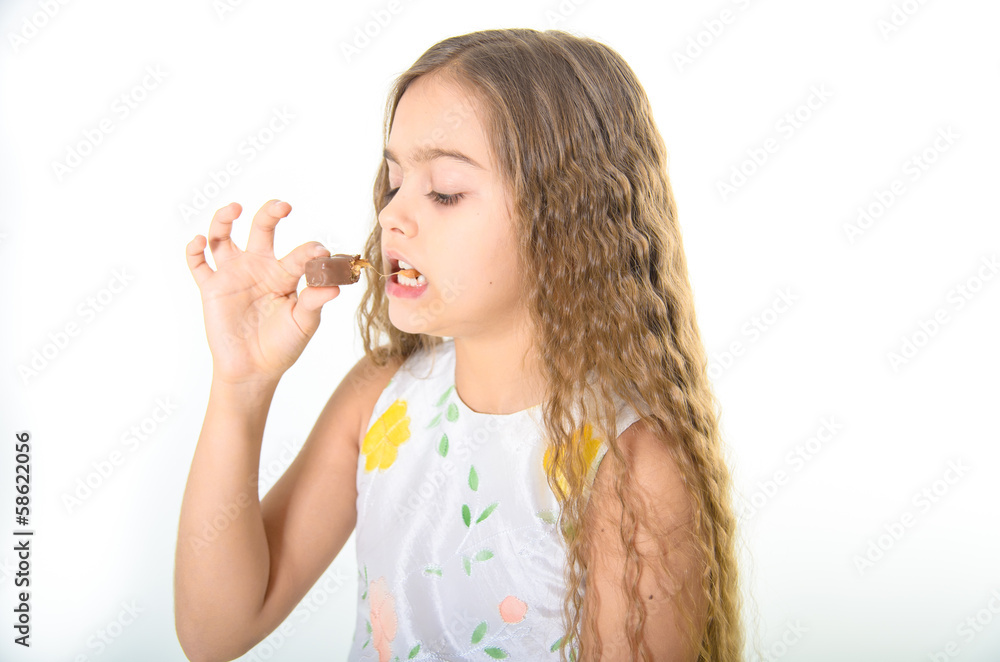 girl biting a chocolate bar. snack, snack, sweet girl biting a chocolate bar. snack, snack, sweet