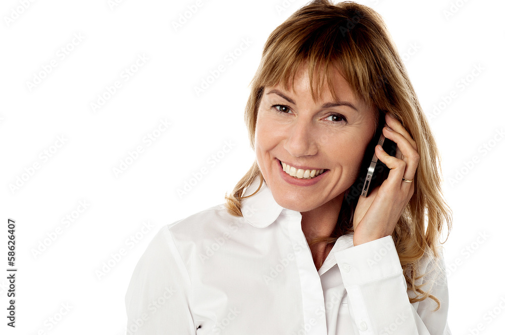 Cheerful woman speaking over cellphone Cheerful woman speaking over cellphone