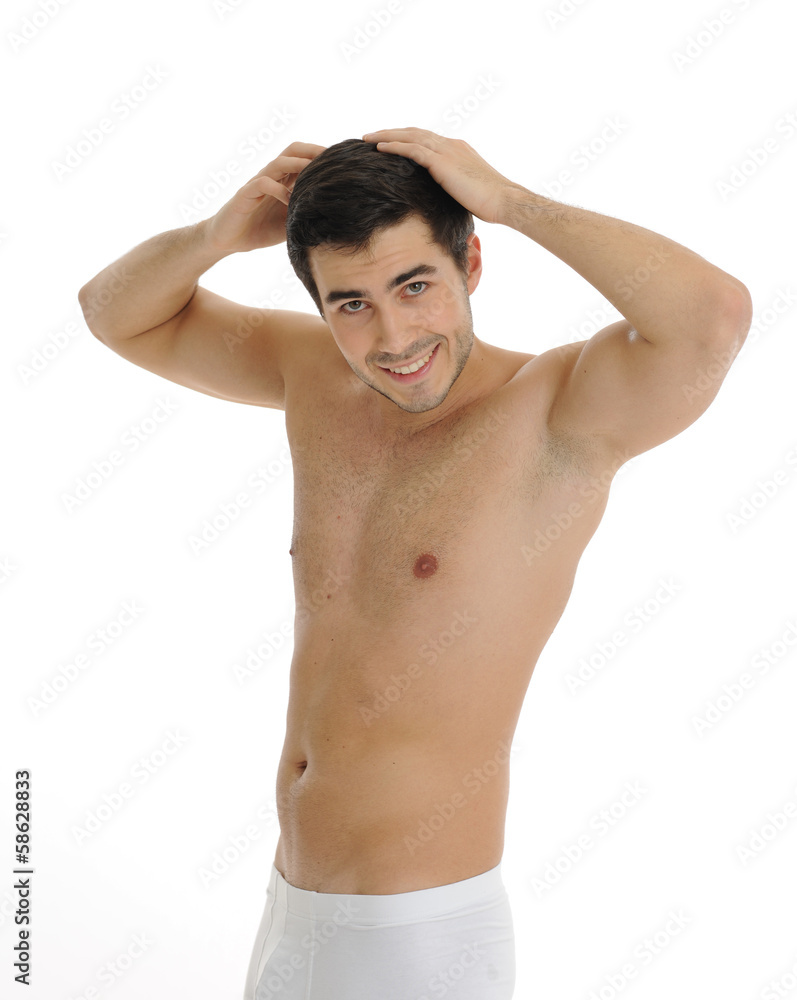 Fototapeta premium junger mann knöpft ein weisses Hemd zu