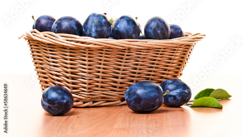 plums in basket