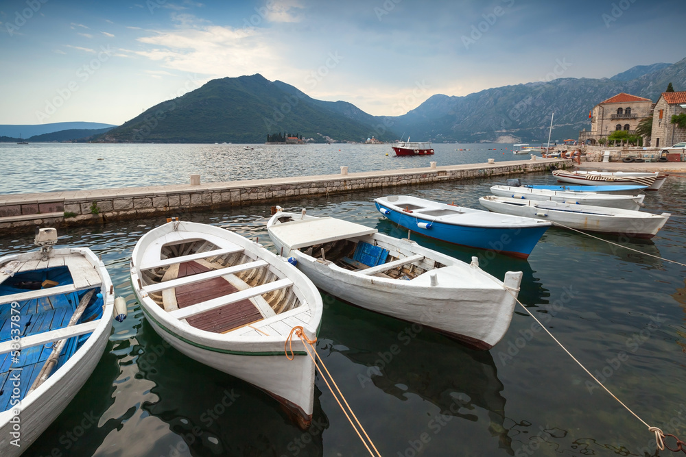 Fishing boats float moored in Perast town
