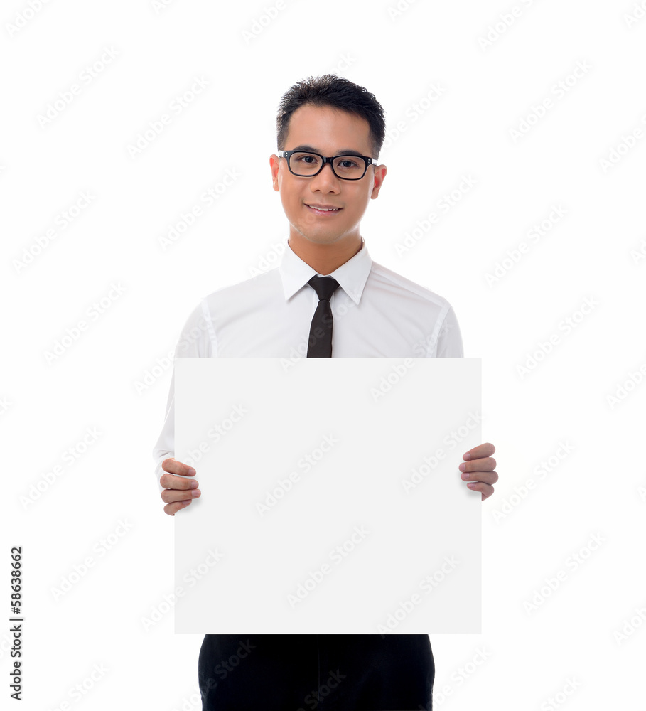 Young businessman holding blank billboard Young businessman holding blank billboard