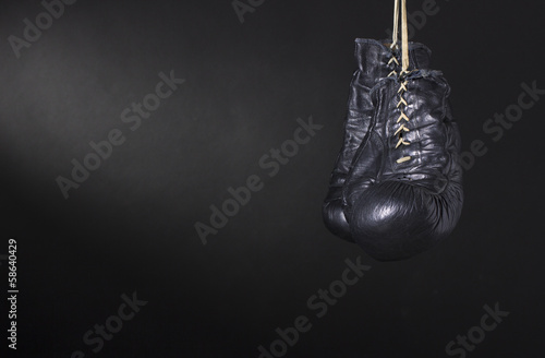 Boxing gloves on a dark background. © papa