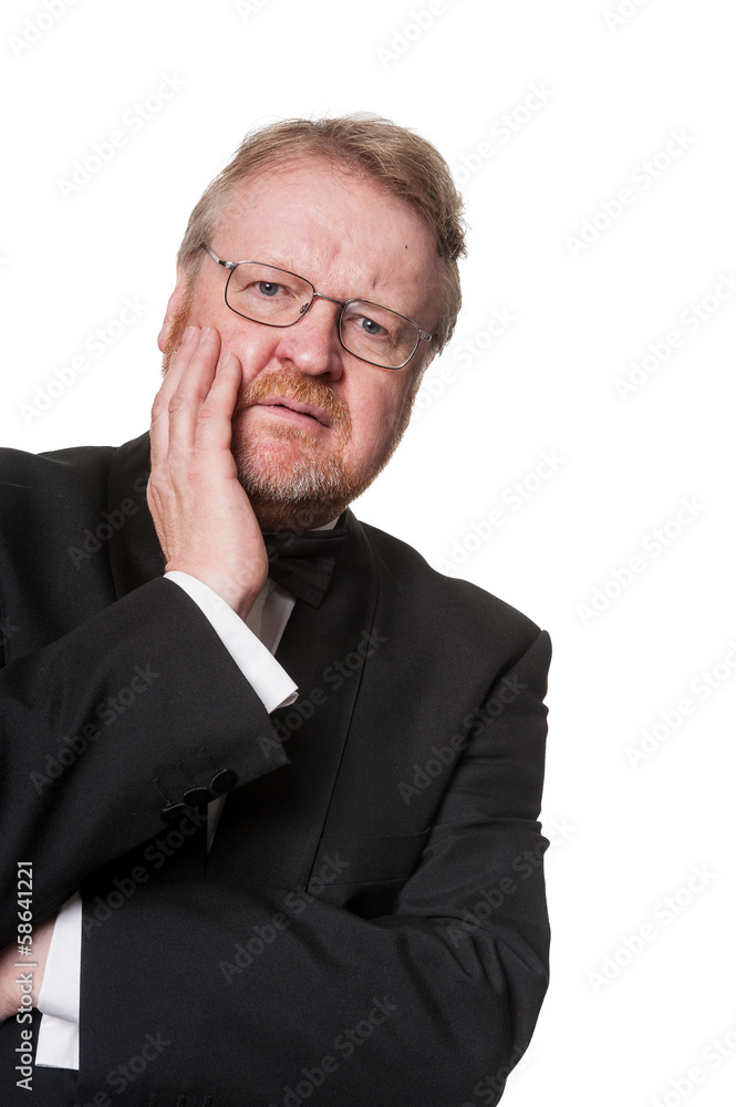 Concerned middle aged man in tuxedo on white Concerned middle aged man in tuxedo on white