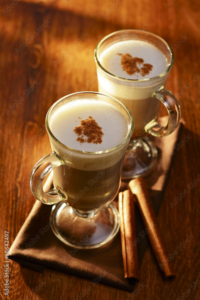 Two mugs of creamy cappuccino coffee Two mugs of creamy cappuccino coffee