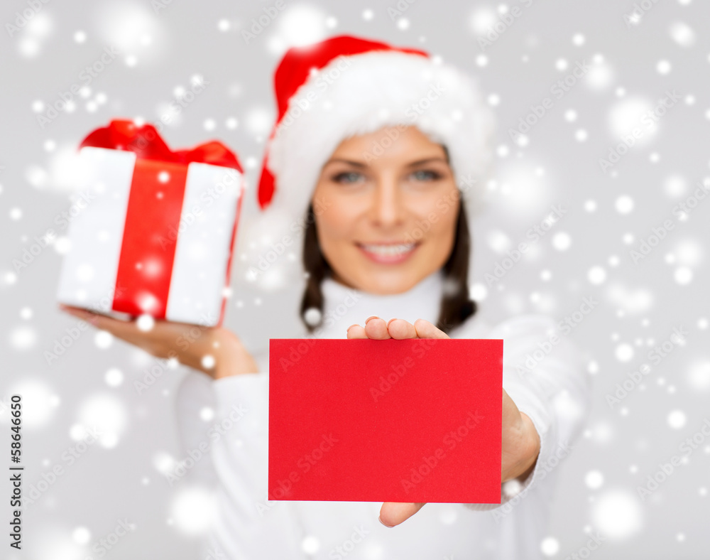 smiling woman in santa helper hat with postcard smiling woman in santa helper hat with postcard