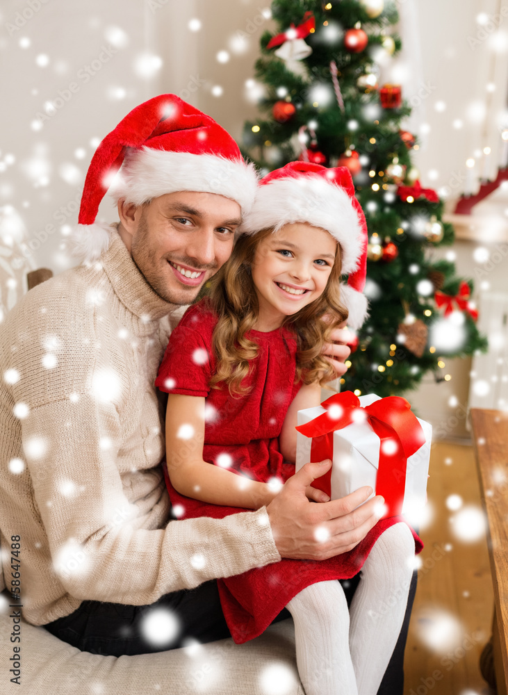 smiling father and daughter holding gift box smiling father and daughter holding gift box
