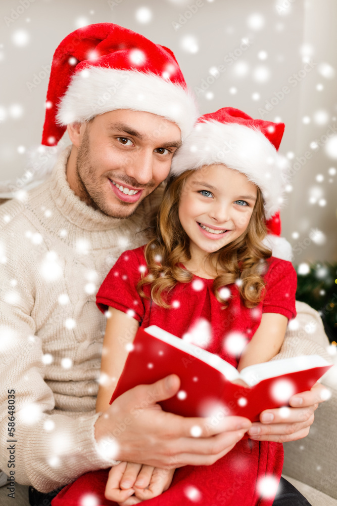 smiling father and daughter reading book smiling father and daughter reading book