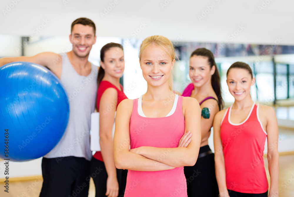 woman standing in front of the group in gym