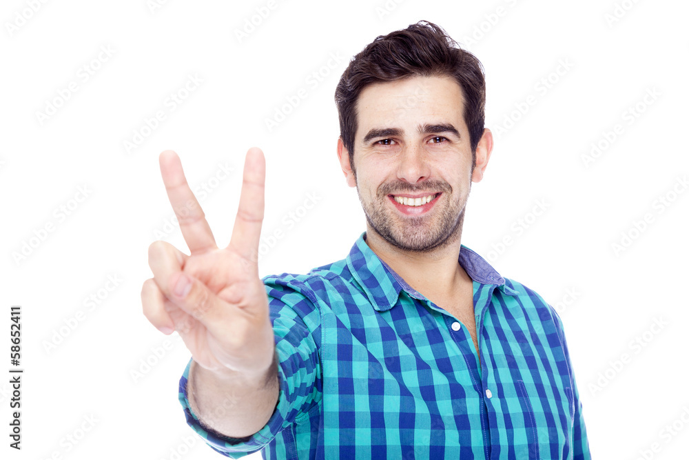 Handsome man giving the victory sign, isolated on white backgrou