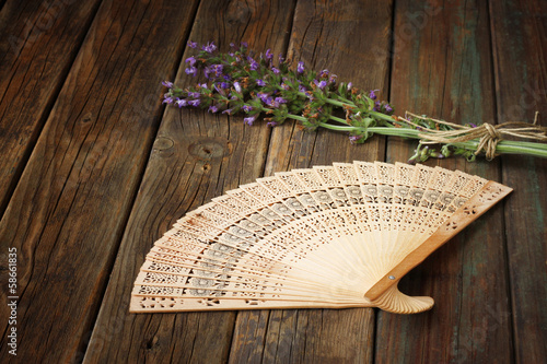 wooden fan on table. summer concept.