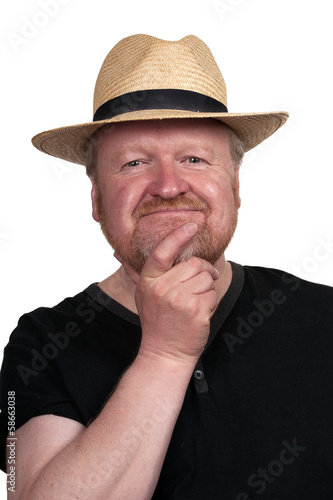 Happy middle aged bearded man in straw hat