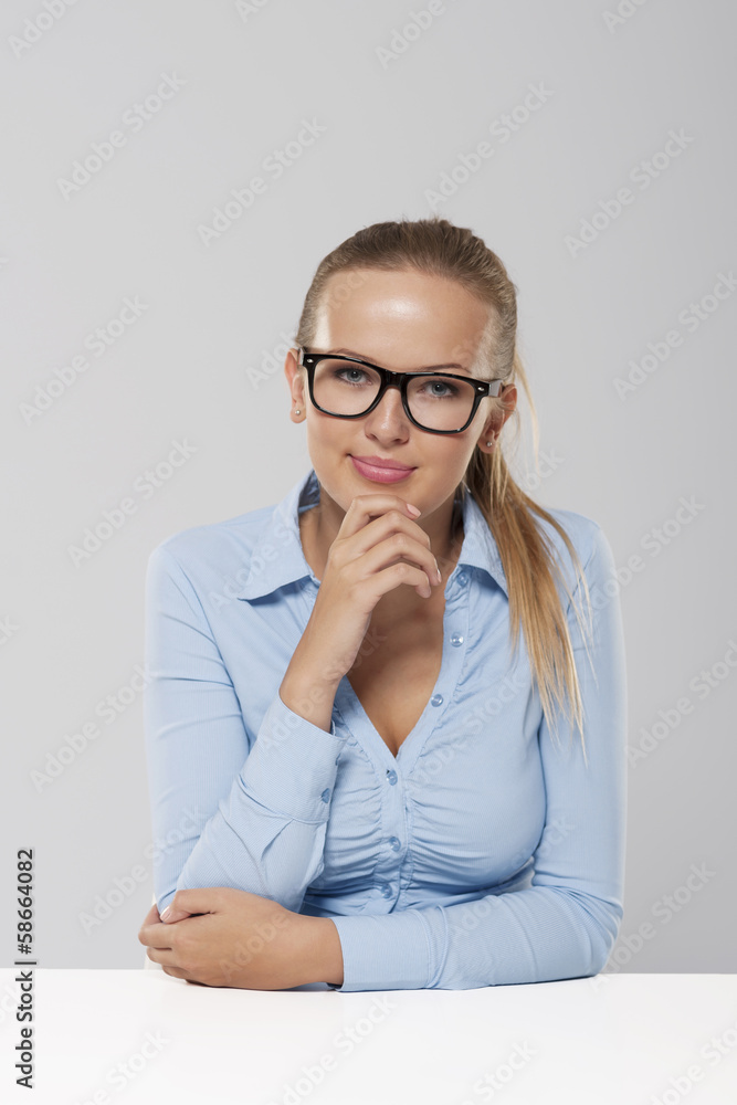 Portrait of smiling blond businesswoman wearing fashion glasses Portrait of smiling blond businesswoman wearing fashion glasses