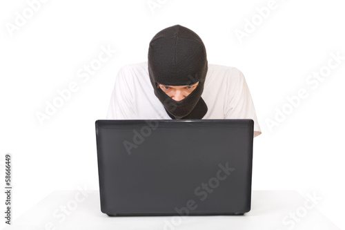 Man in black mask looking at monitor