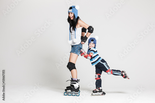 Mother and son in roller skates