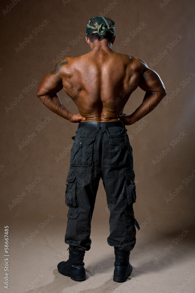 A muscular man with a naked torso in full view. A muscular man with a naked torso in full view.
