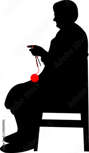 Silhouette of a grandma with big glasses, knitting while sitting