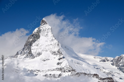 Obraz na plátně Matterhorn peak among clouds