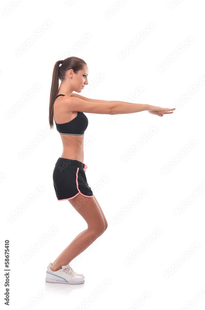 Young woman doing a squat