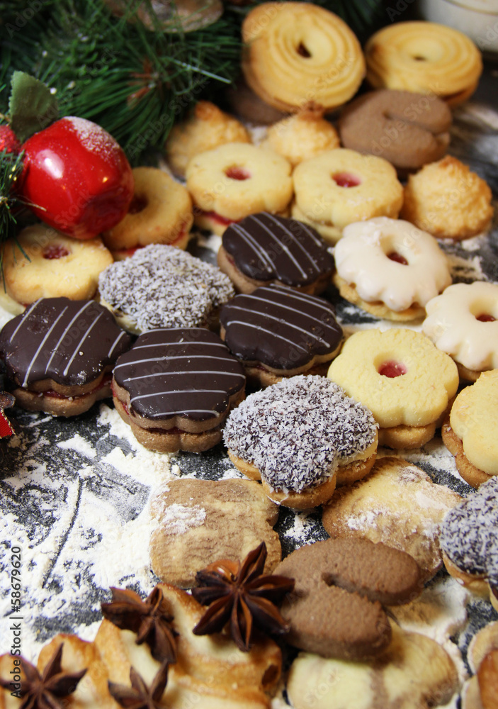 Mix of Christmas cookies with cinnamon on the table Mix of Christmas cookies with cinnamon on the table