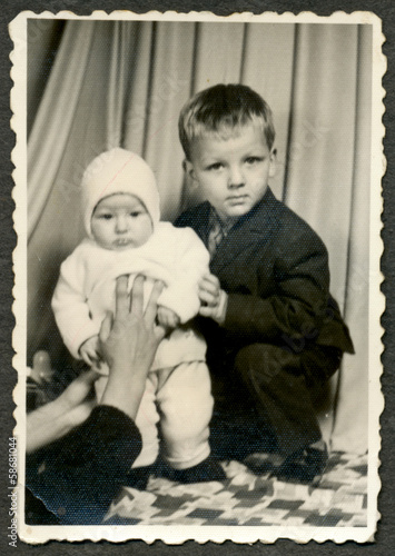 Two children, siblings, joint photograph - circa 1960