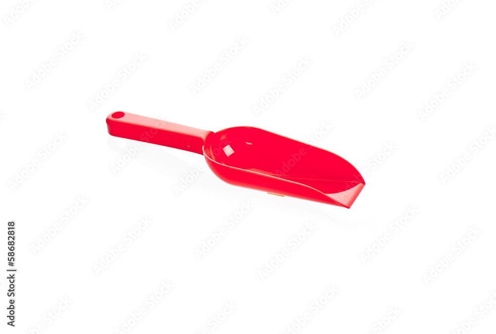 Red plastic transfer scoop used in cooking, isolated on white Red plastic transfer scoop used in cooking, isolated on white