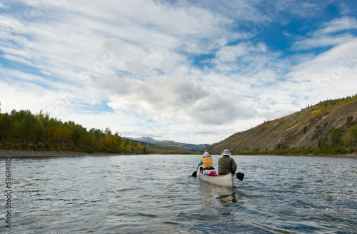 Wilderness adventure canoeists paddle Pelly River