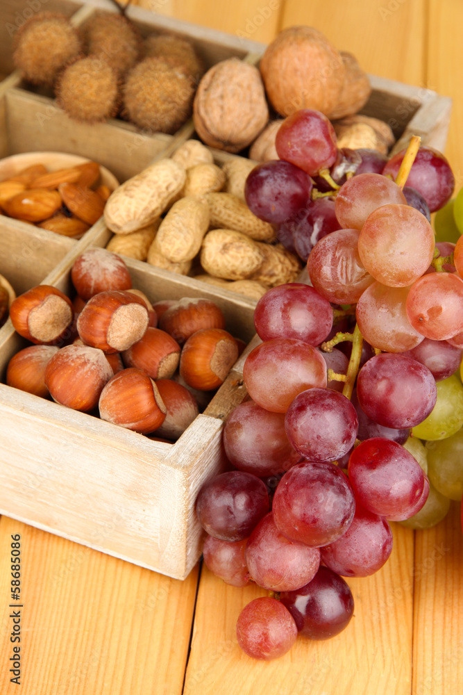Grape with nuts on wooden table Grape with nuts on wooden table