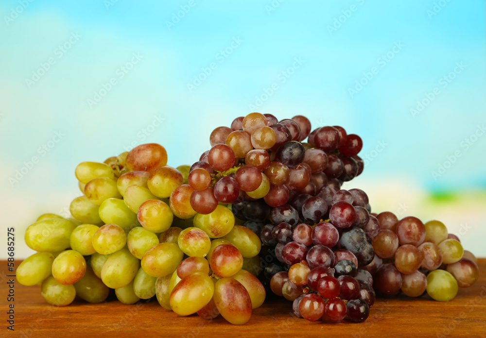 Fresh grape,on wooden table, on bright background