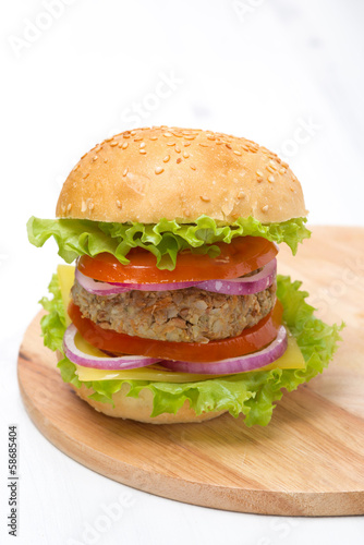 Burger with a vegetarian cutlet and fresh vegetables