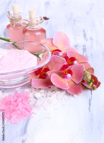 Spa treatments on color wooden background